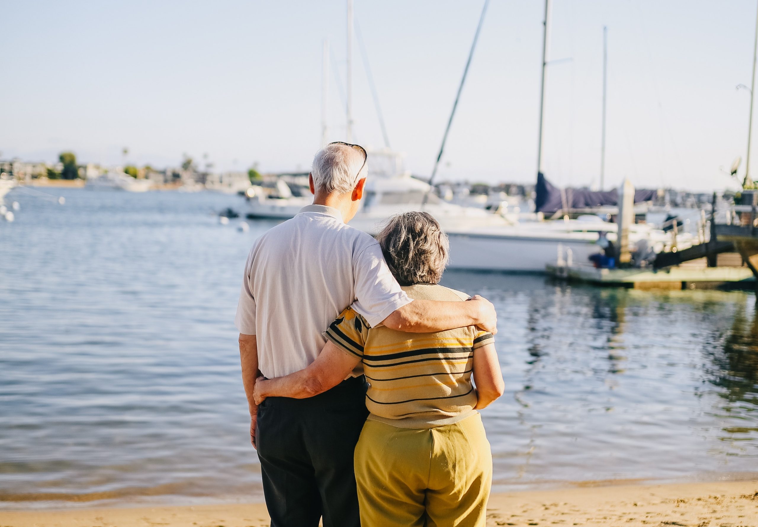 A couple looking out over a harbor — planning the life ahead of them.