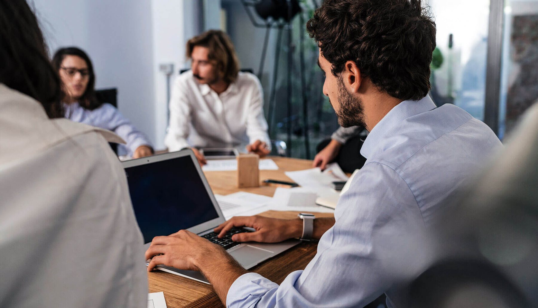 The Mill Financial Partners team collaborating in a meeting.